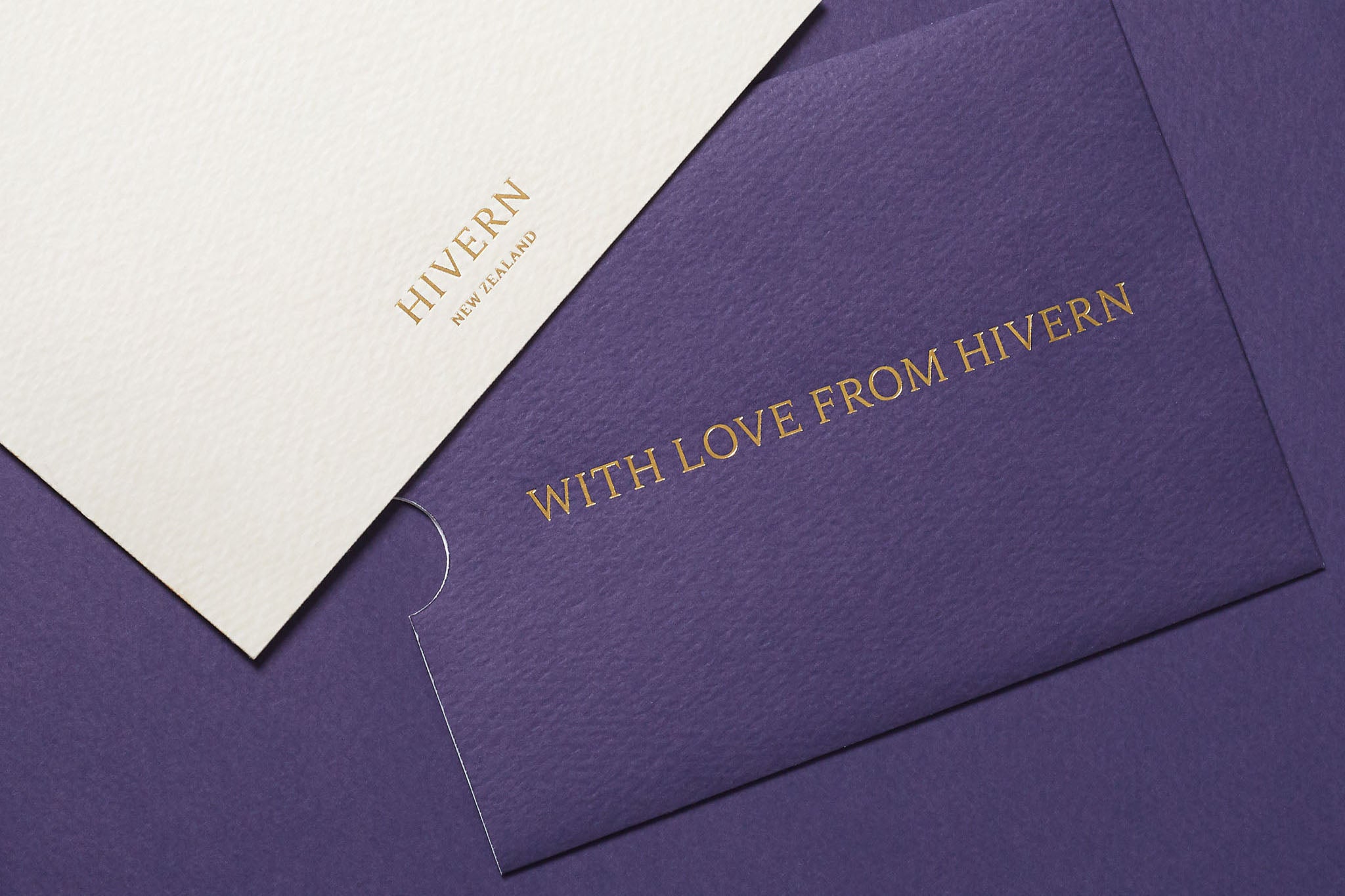 Gift card envelope displaying "With Love From Hivern" text in gold foil, alongside the corresponding gift card displaying the Hivern New Zealand logo in gold foil.